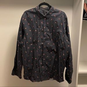 Mens dark blue Saturn patterned button down shirt.